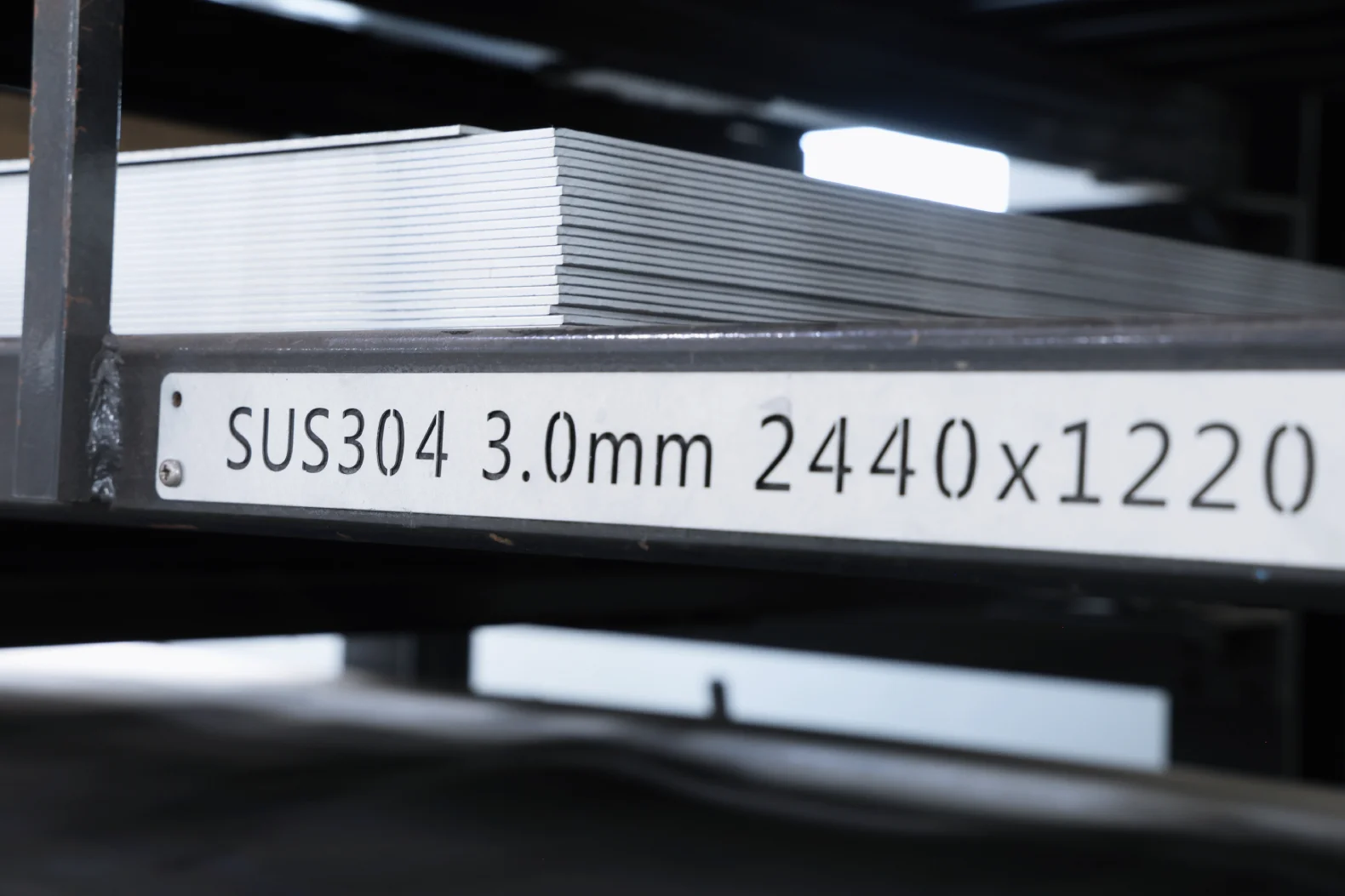 Stack of 3.0 mm SUS304 stainless steel sheet on a stock rack at Boda