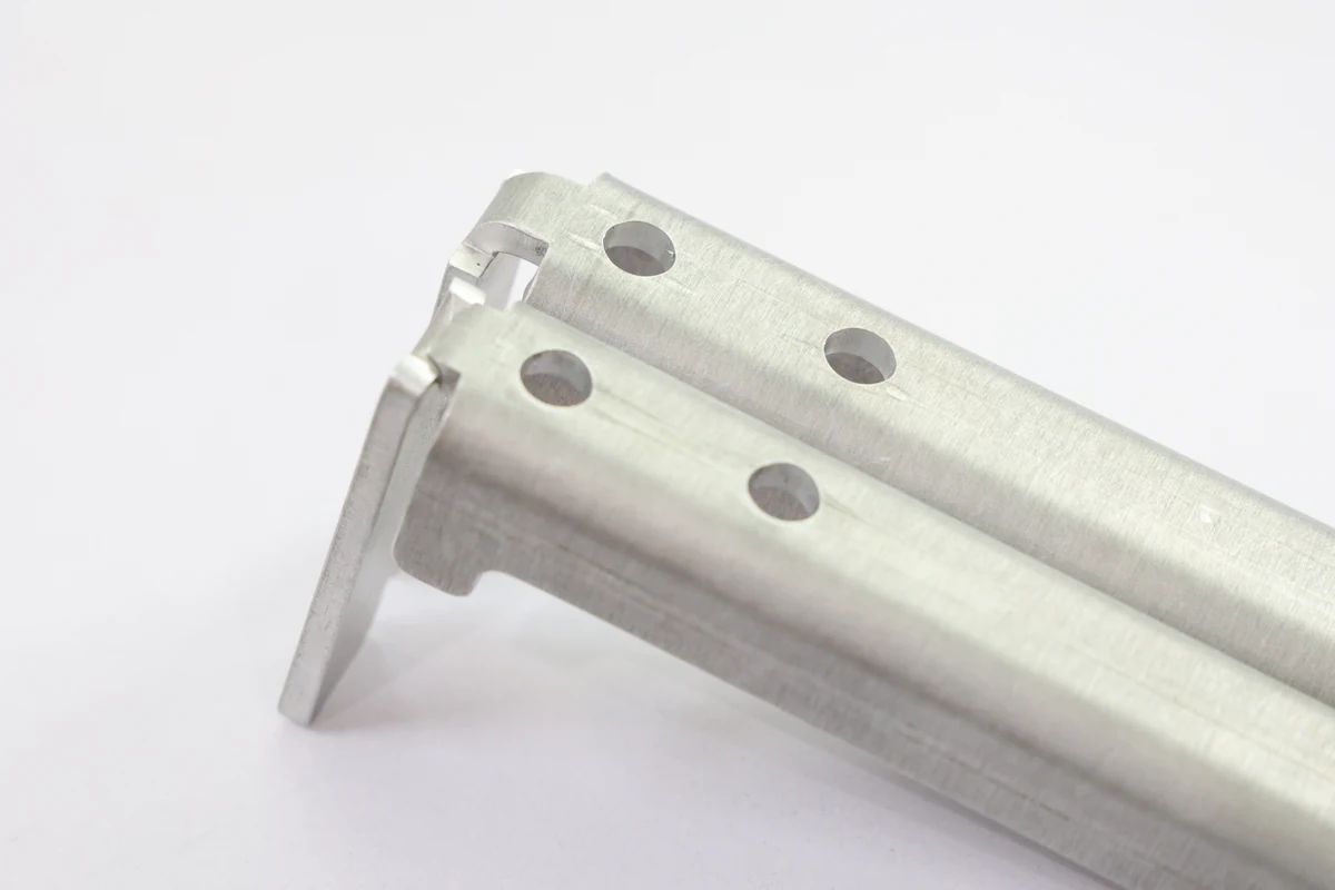 Bent sheet metal bracket with round holes placed clear of the bend line